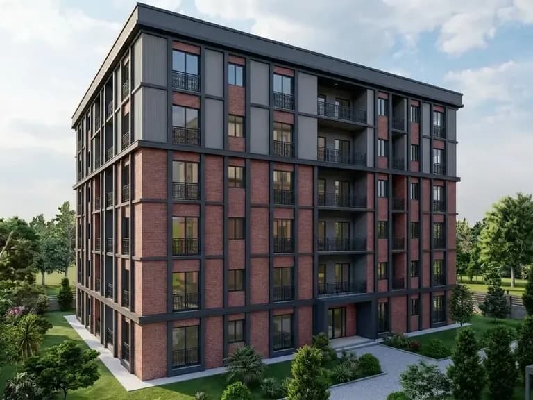 Modern, çok katlı bir apartman yapısı; kırmızı tuğla cephe, siyah metal detaylar ve yeşil alanlar.
